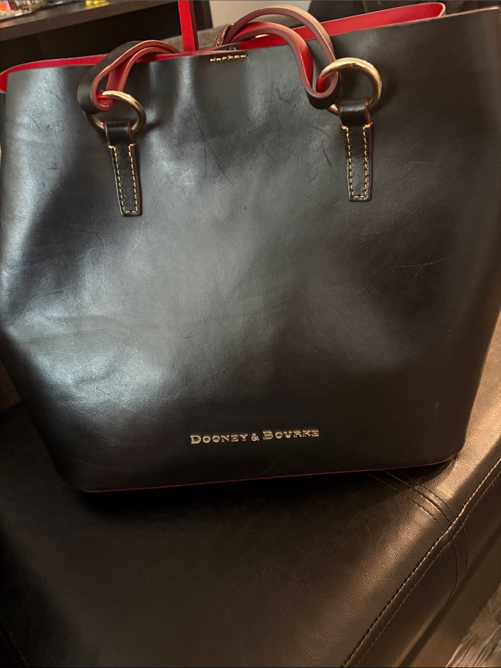 Dooney & Bourke Black Leather Tote with Red Trim Accents